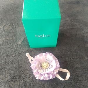 Empty Tieks box, and flower topper